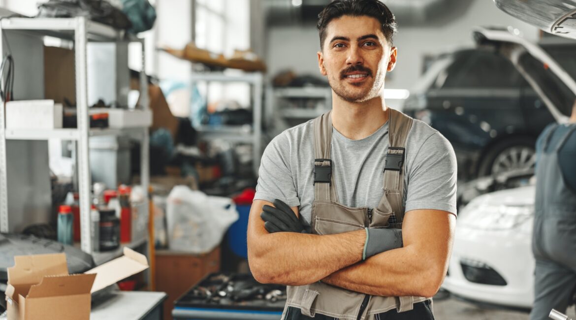 Portrait of a male mechanic in an auto repair shop